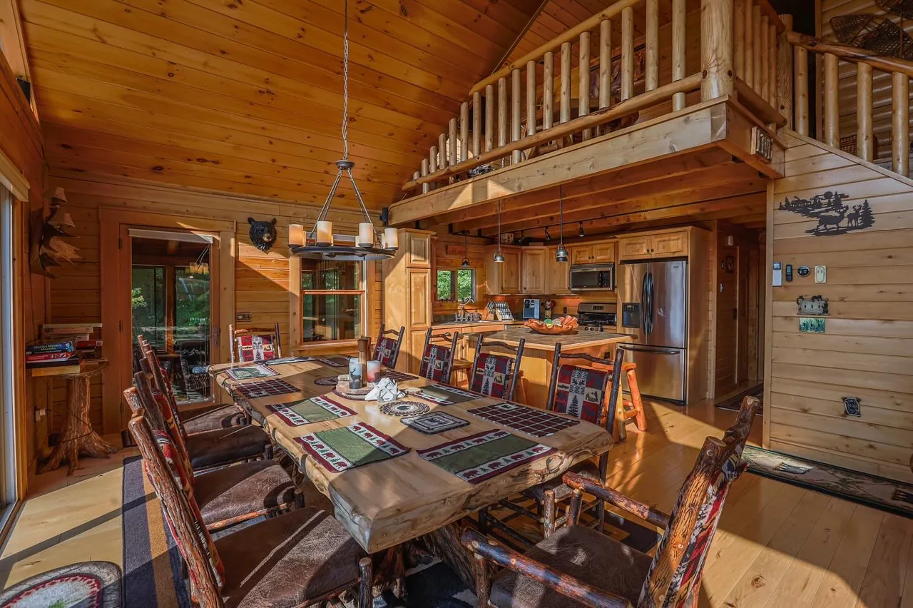 Ten-chair dining table beneath the timber ceiling