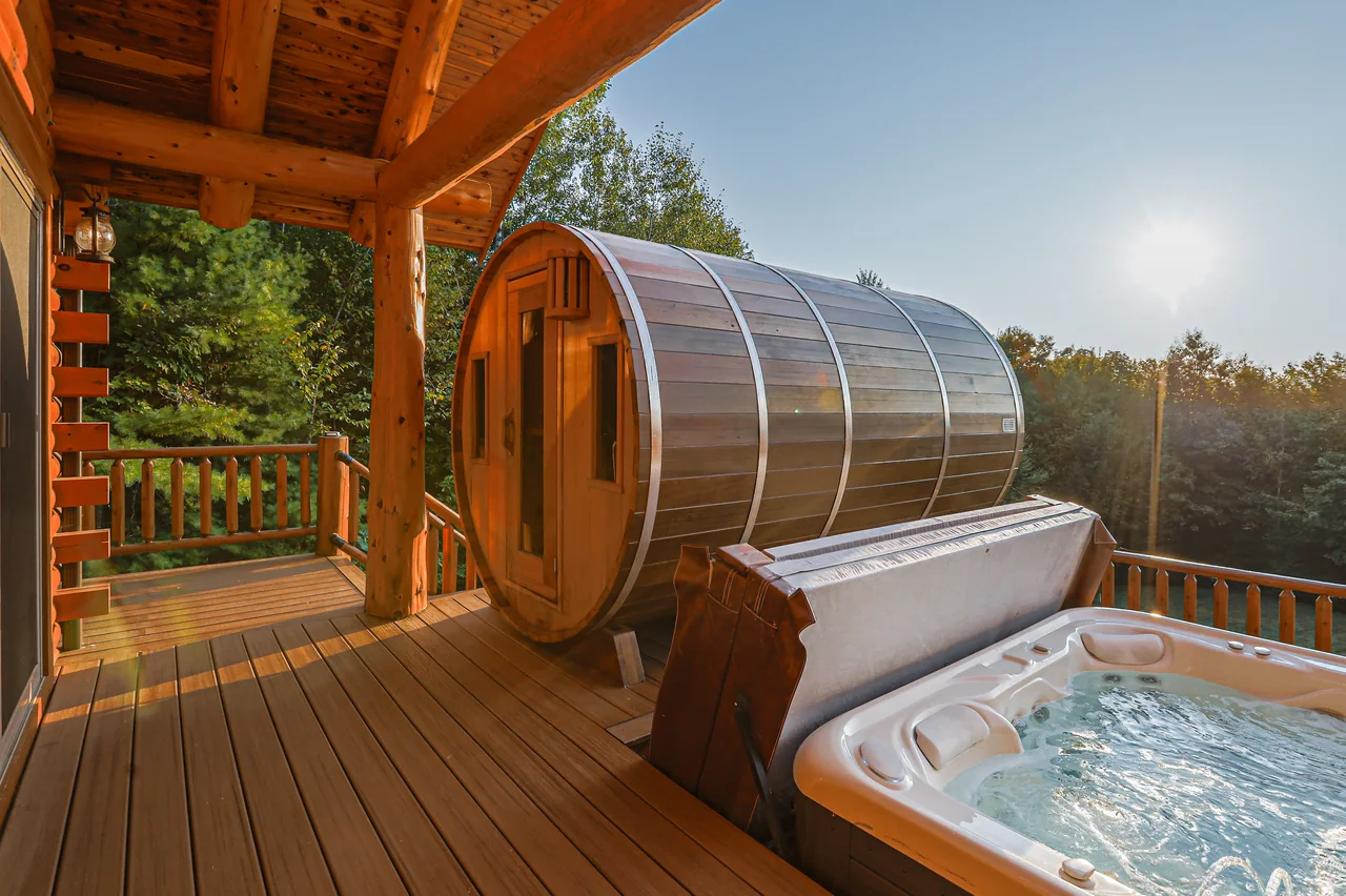Hot tub beside the barrel sauna on the cabin deck